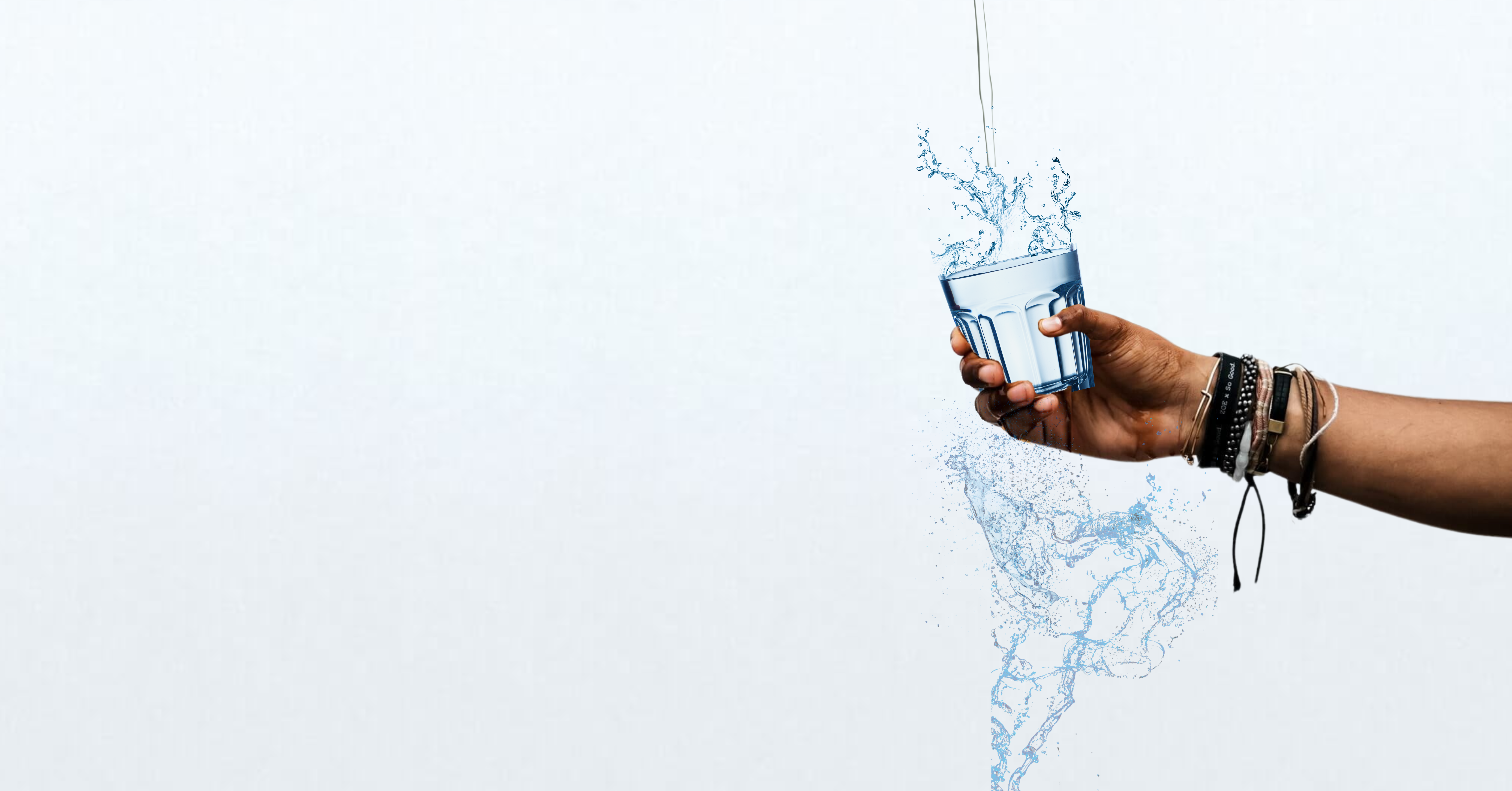 hand holding a glass of water being filled